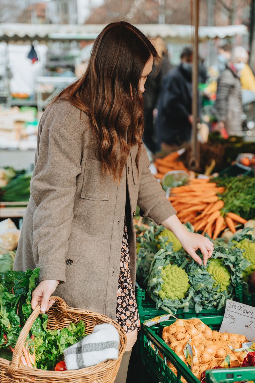 woman looking at vegetables